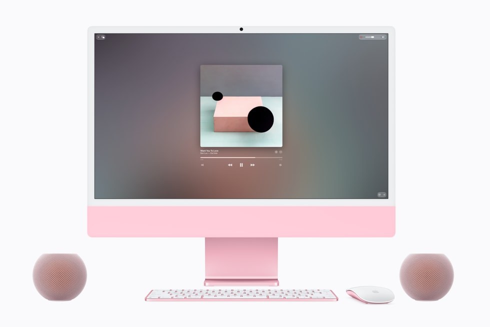 Dos HomePod mini 2 rosas junto a un iMac a juego